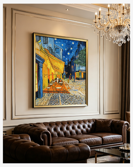 Van Gogh Cafe Terrace at Night oil painting hanging above a luxury dark leather sofa with a crystal chandelier