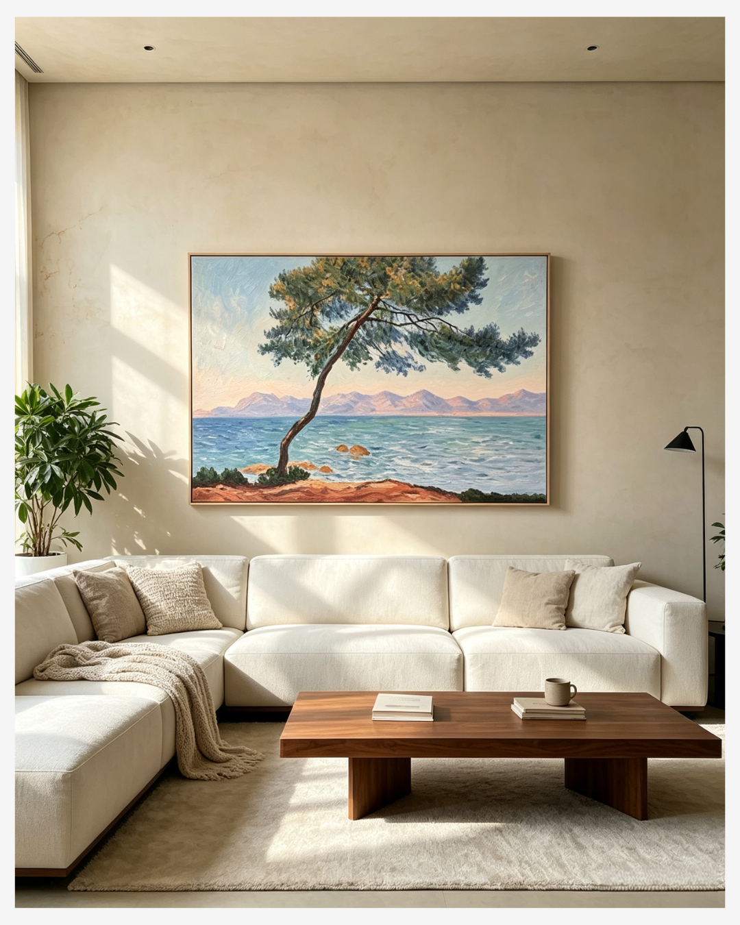 Monet Antibes coastal landscape canvas wall art above sofa in modern neutral living room