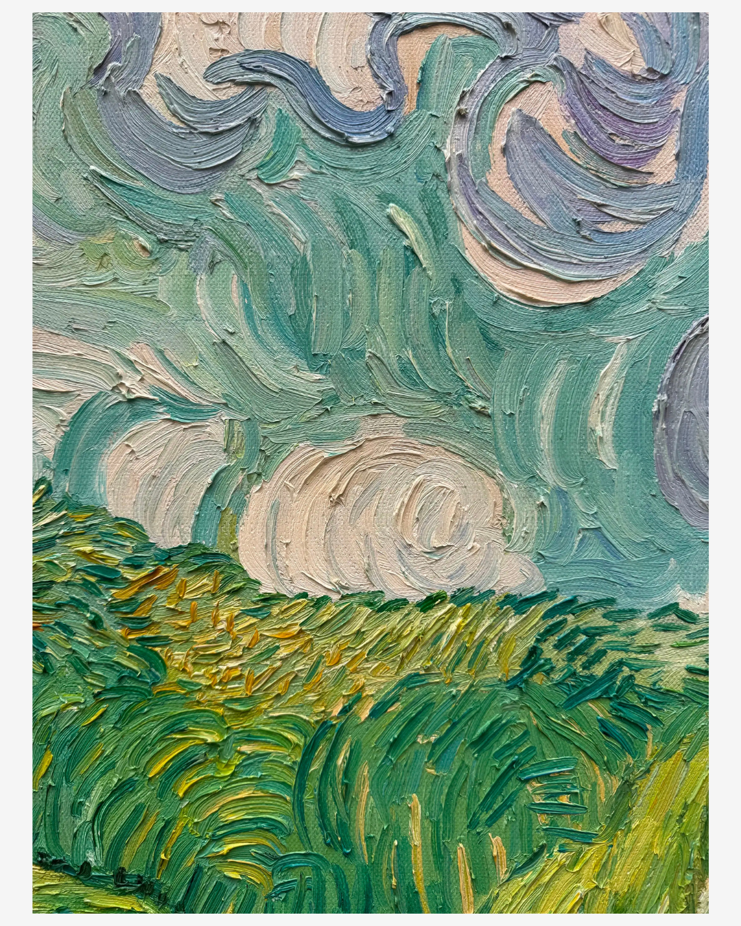 Close-up view of swirling sky and green wheat brushstrokes on Van Gogh Green Wheat Fields oil painting