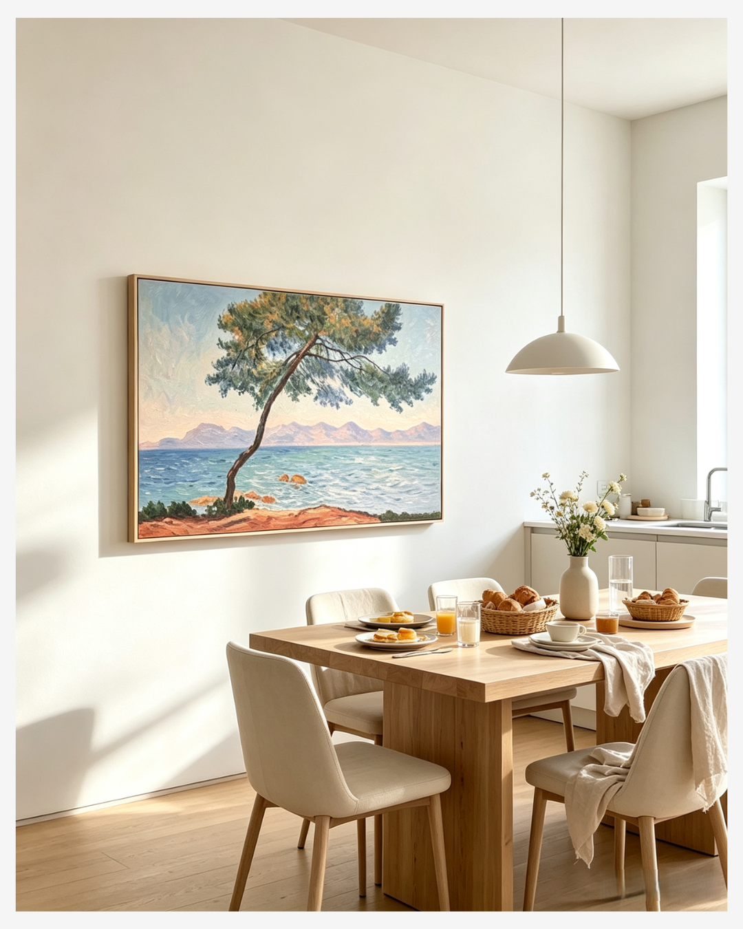 Handpainted Monet Antibes coastal oil painting above dining table in bright minimalist dining room